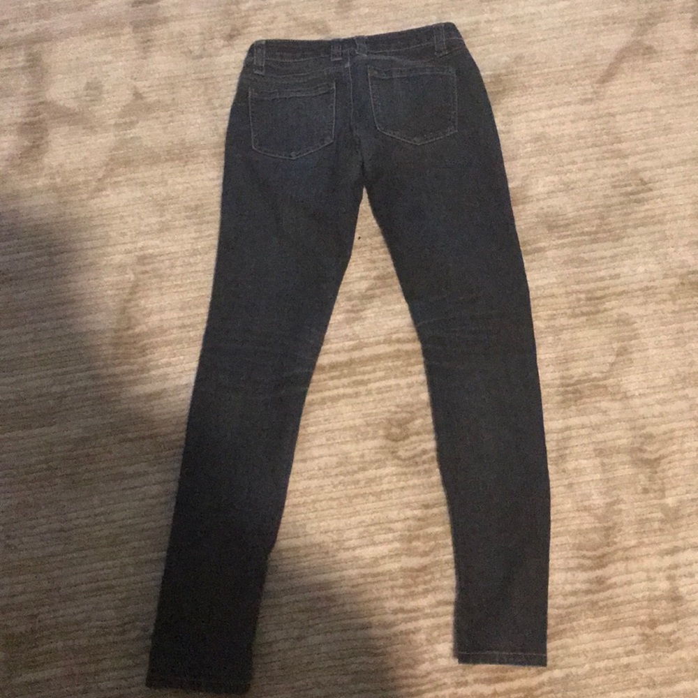 Blue dark watch jeans.